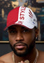 Man wearing a red and white cap with 'SPL Style' branding, gold chain necklace, and earring.