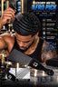 A man with styled black afro hair uses a black metal afro pick comb in a bar setting. The image includes product text, feature icons, and close-up inset views of the comb design and reinforced teeth.