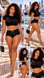 A five-panel collage showing a woman modeling a black crop top and black high-waisted shorts on a yacht deck with water and a city skyline in the background. The top has a red and pink winged logo that reads 'SPI STYLES'.