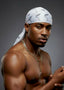 Man wearing a white bandana with a logo on a gray background