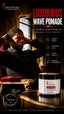 A man in a black suit sits in a red armchair in a luxurious interior, with a jar of SPI STYLES Luxurious Wave Pomade displayed in the foreground. The image features promotional text highlighting hair and scalp health benefits.