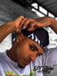 High-quality white silk durag adorned with a dynamic flame motif, providing excellent hair protection and a distinctive look.