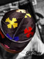 Signature black velvet durag featuring colorful cross designs, combining premium wave compression with unique style