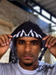 Luxurious white silk durag with a striking flame pattern, crafted for optimal wave formation and unique fashion appeal.