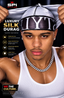 A man wearing a silver and black luxury silk durag with 'LTYC' printed on it, pulling the fabric upwards. The image features promotional text for 'SPI STYLES' and 'LUXURY SILK DURAG' on a dark background.