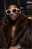 Man wearing a fur coat and sunglasses with a cityscape background