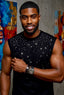 Man wearing a black sleeveless shirt with star patterns in front of colorful wall art.