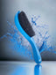 A blue curved wave brush with black bristles, depicted with water splashing around it, indicating motion.
